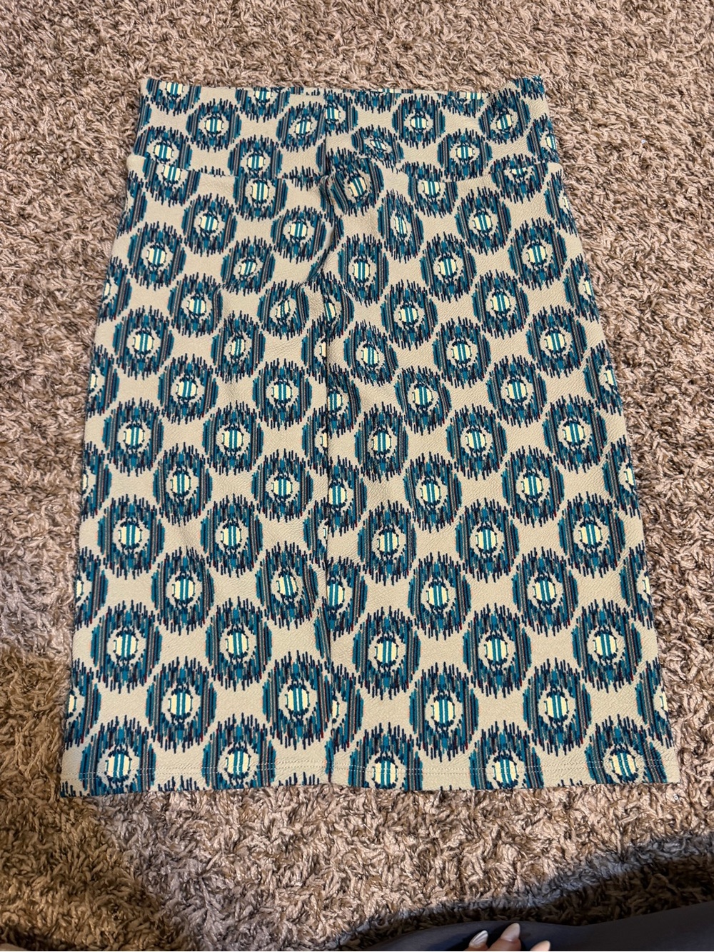 LuLaRoe Cassie pencil skirt features a teal and navy geometric medallion pattern